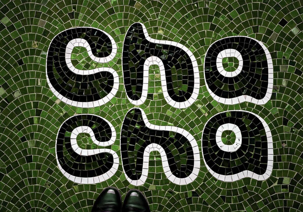 Chacha lettering set in a green mosaic floor
